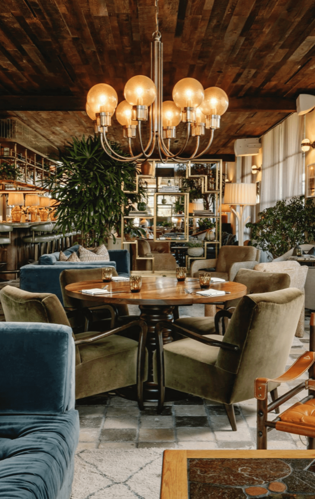 Soho House Austin restaurant interior with tables, seats, chandelier
