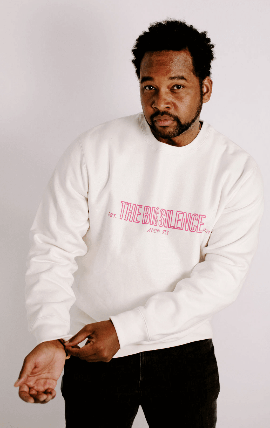 James in cream TBS sweatshirt