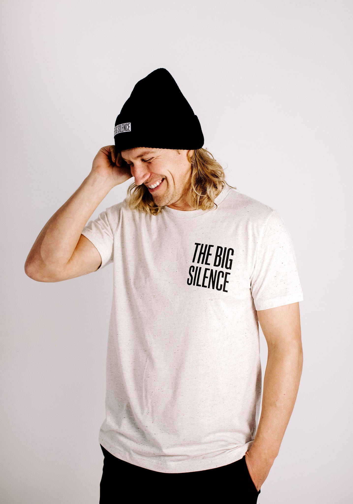 Bobby Gold in oatmeal logo tee and black beanie