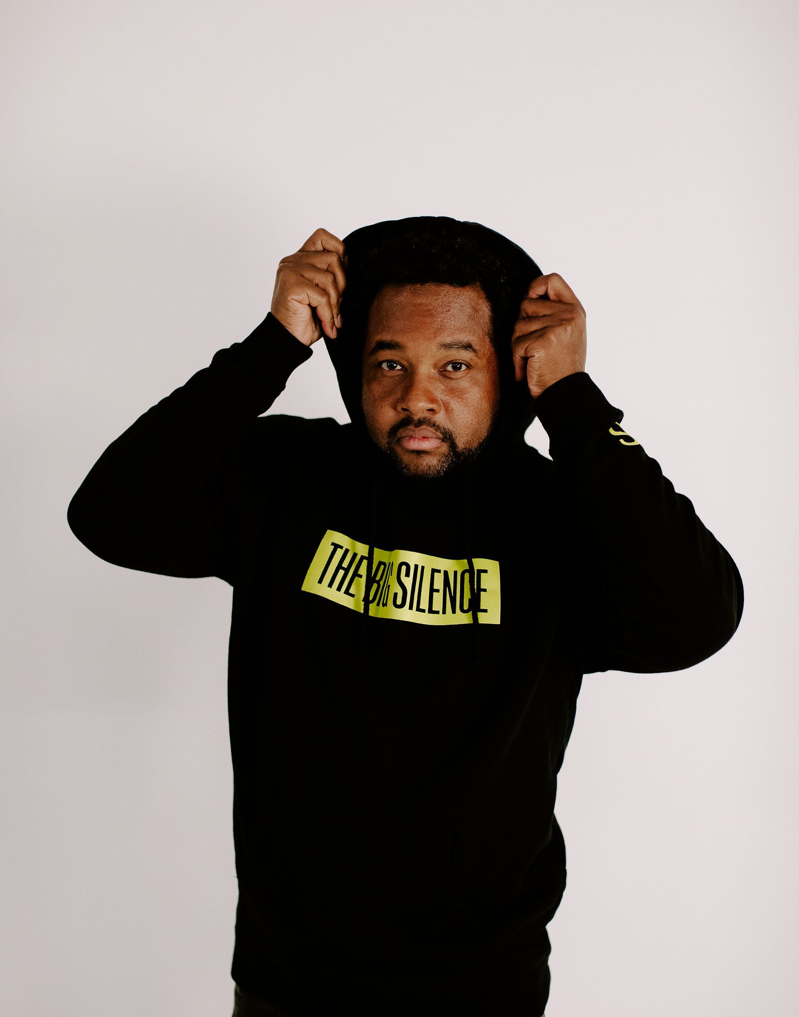 James shows off the hood of the TBS pullover hoodie