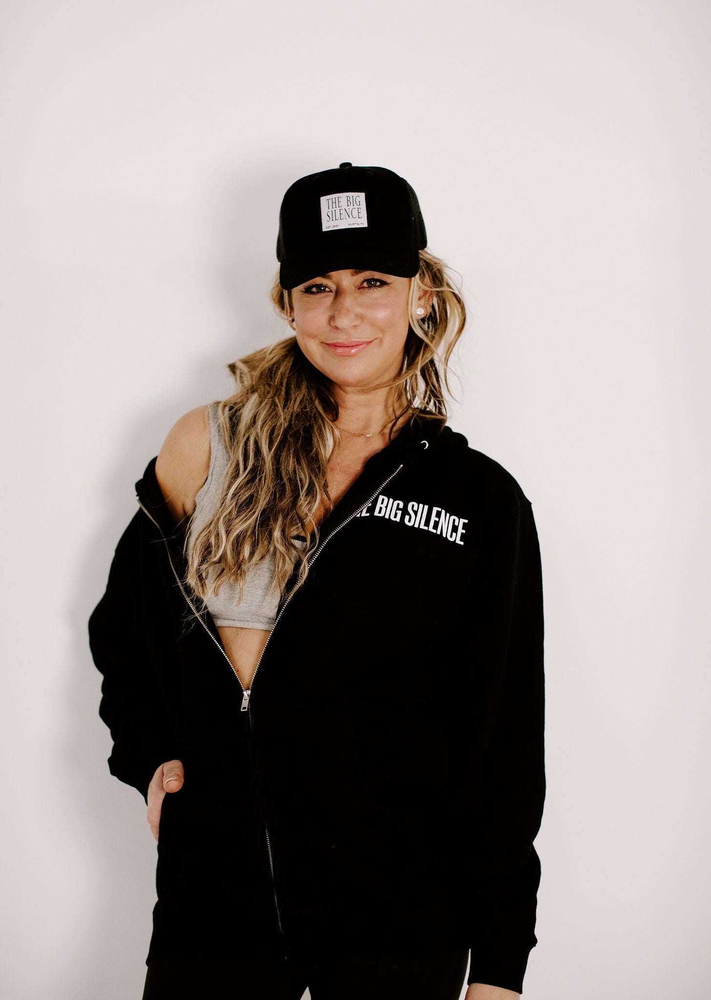 Karena in TBS hoodie with trucker hat and crop top