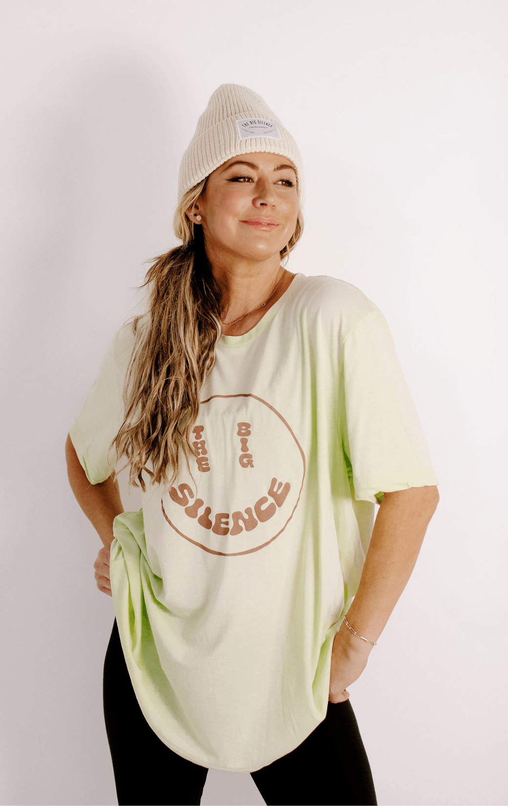 Karena in the TBS smiley tee and cream beanie